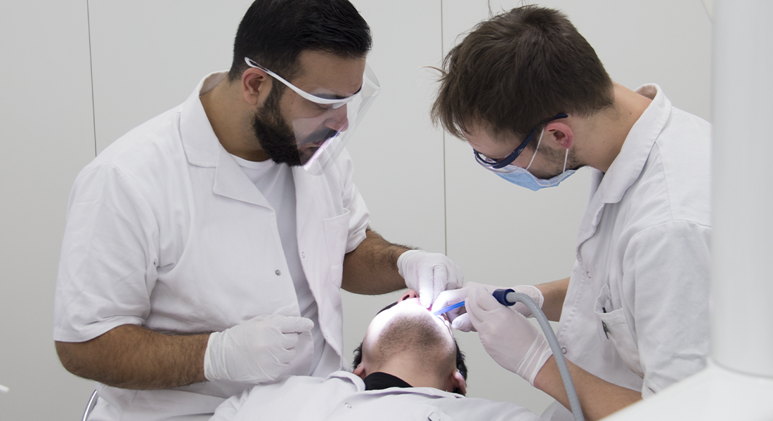 3 dental Hygienist treating a patient